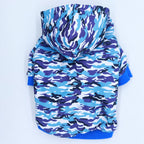 Blue Camouflage Dog Hoodie – small hooded pet sweatshirt with blue, purple, and white camouflage pattern, shown from the back