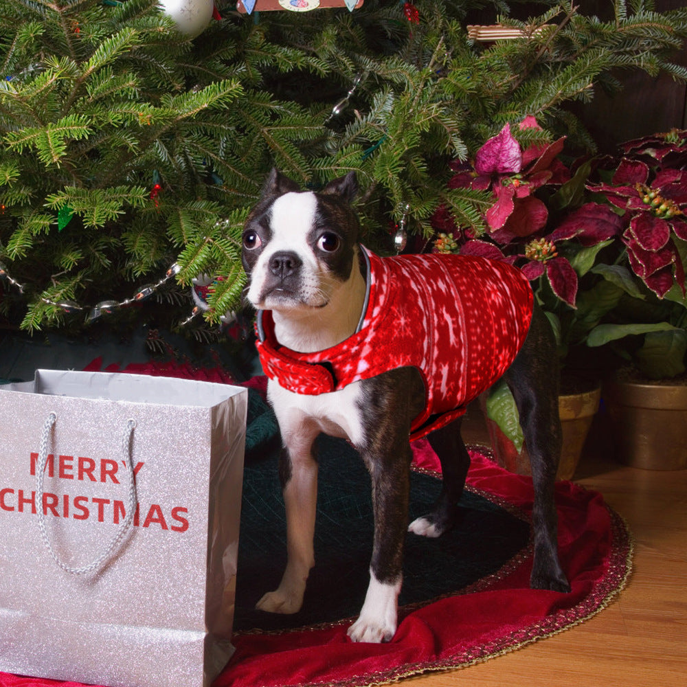 Christmas Fleece Dog Sweater – dog in a red coat standing next to a Christmas tree and gift bag