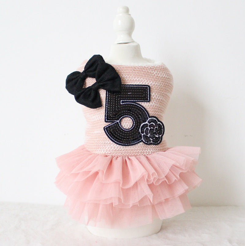 Double-Bow Dog Dress – pink dress with number 5 and bow on a mannequin, product photo
