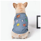 Embroidered Denim Dog Vest – dog wearing the denim vest with colorful patches, front view