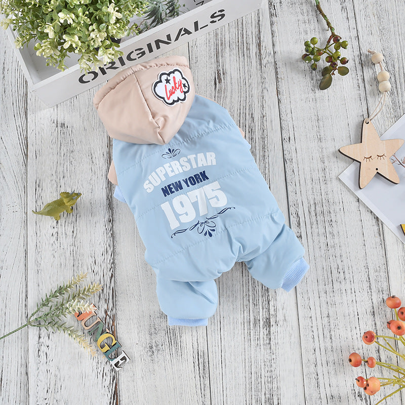 Padded Four-Leg Dog Coat – light blue padded dog coat with 'Superstar New York 1975' text on a wooden surface