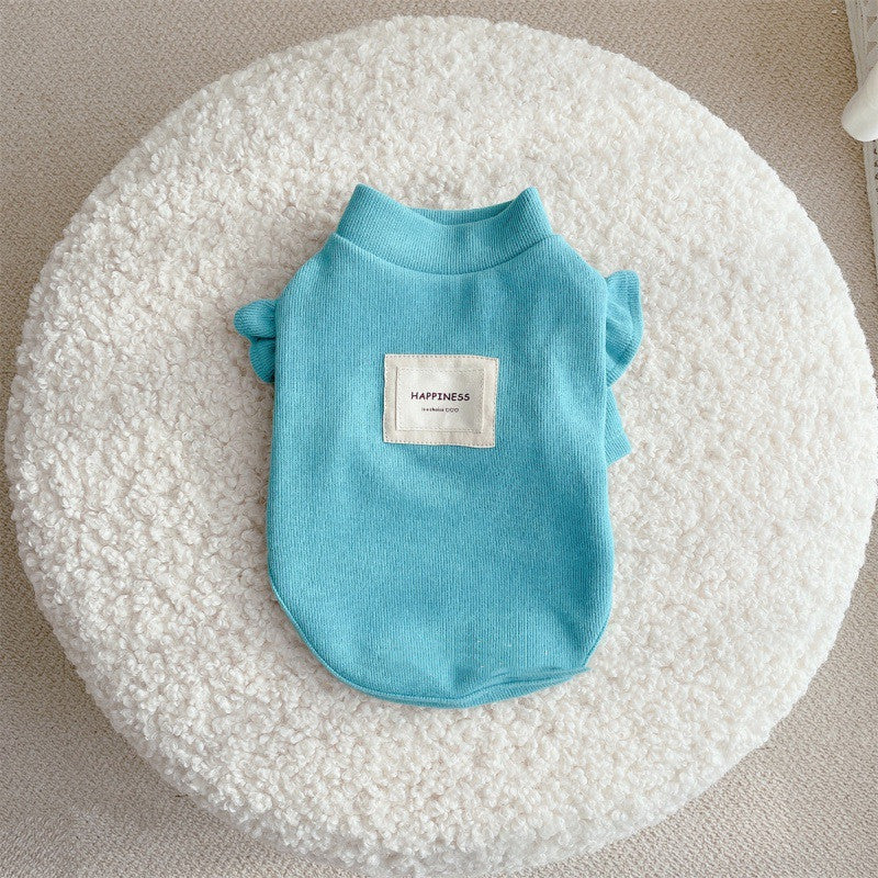 Ruffle-Sleeve Dog Sweater – blue pet sweater with a 'Happiness' label on a textured white surface