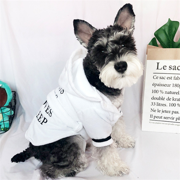 White Hooded Dog Bathrobe – dog wearing a white outfit with text on a light gray background