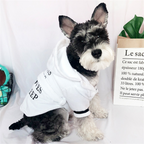 White Hooded Dog Bathrobe – dog wearing a white outfit with text on a light gray background