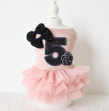 Double-Bow Dog Dress – pink dress with number 5 and black bow on a mannequin, product photo