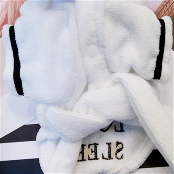White Hooded Dog Bathrobe – white robe with black trim and 'Sleep' text on a soft pink background