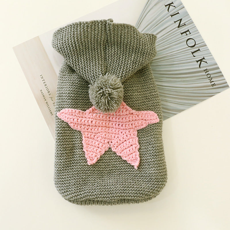 Star Knit Pet Sweater – knitted dog sweater with a pink star design on a white surface